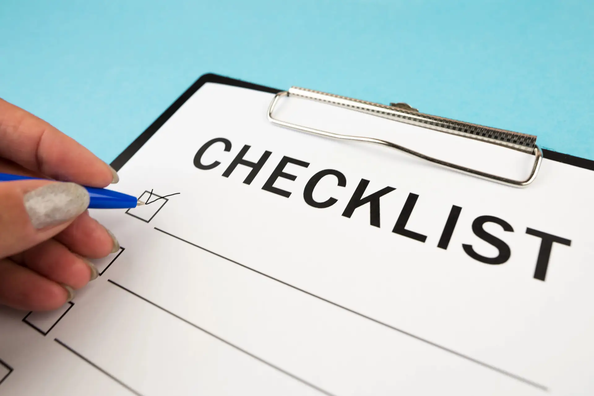 Inspector reviewing a property field inspection checklist during site visit