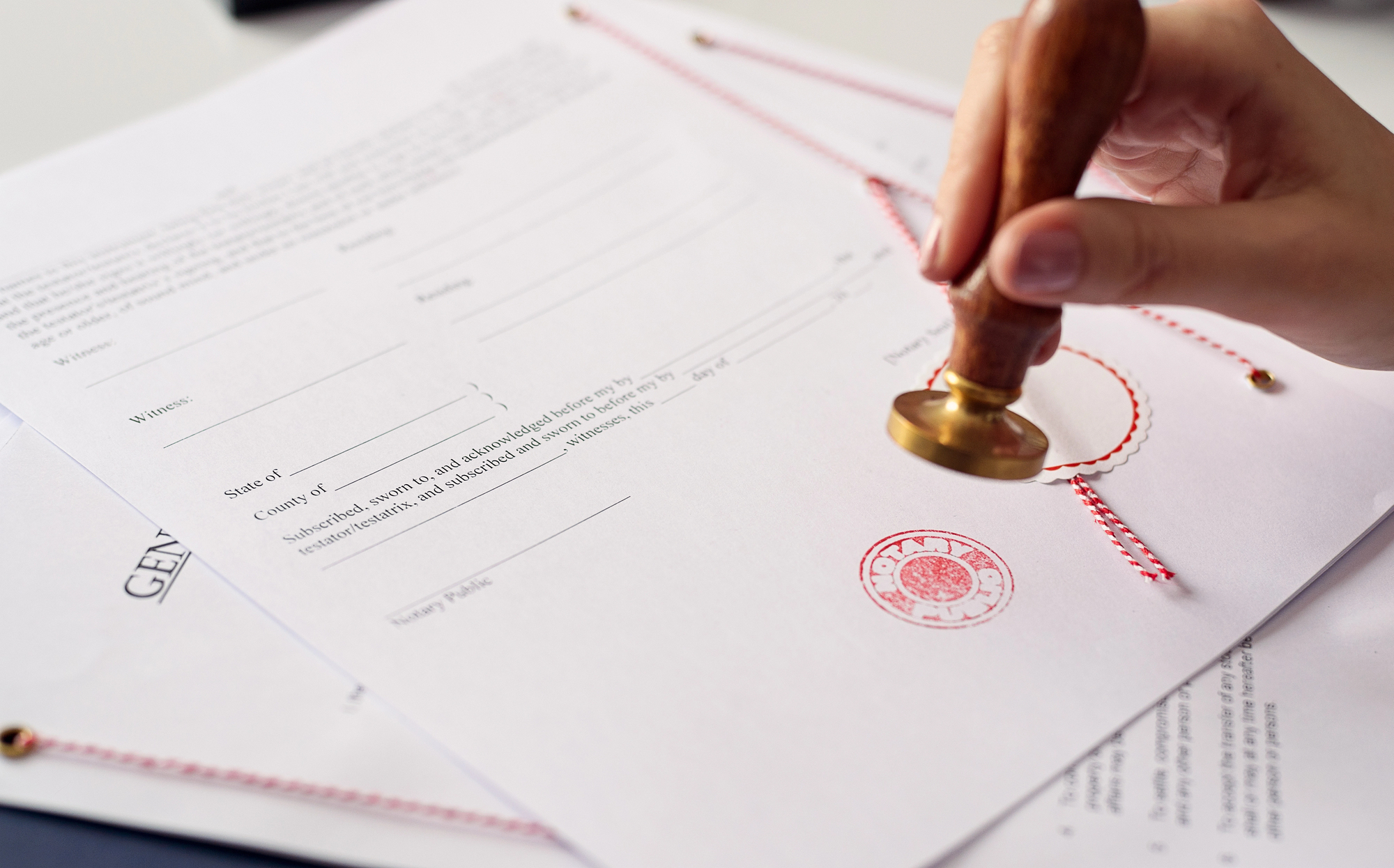Notary public stamping an official legal document in Warren County, NJ