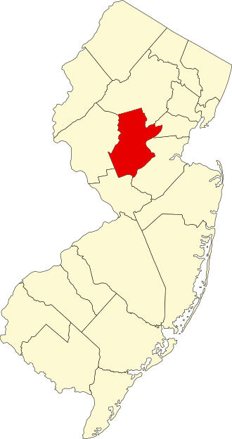 Outline map of New Jersey with one central county highlighted in red, indicating its location within the state.